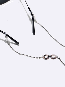 Silver bead eyewear chain with tortoiseshell pendant and clear silicone anti-slip loops