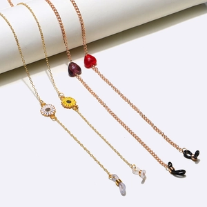 Set of four gold and rose gold eyeglass chains with daisy and heart charms