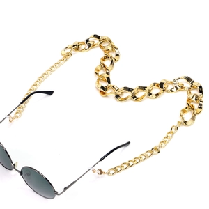 Thick gold-plated aluminum curb chain eyewear strap with white silicone connectors