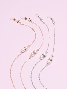 Set of 4 gold and silver pearl eyewear chains with rhinestones on purple background