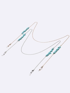 Two-piece eyeglass chain set in gold and silver with turquoise stones and silicone loops