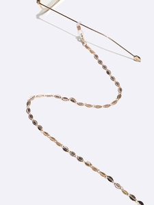 Elegant gold leaf glasses chain with detailed leaf pendants and adjustable rubber loops