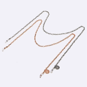 Two-piece metal eyewear chain set in silver and rose gold with tree of life pendants