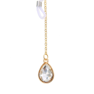 Chaîne de lunettes dorée avec pendentif en cristal en forme de larme sur fond blanc épuré