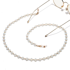 Golden eyewear chain with translucent crystal beads and non-slip rubber loops for sunglasses