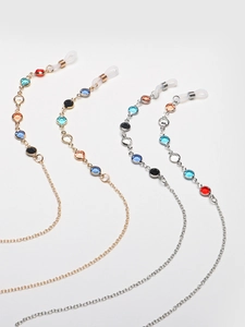 Set of gold and silver eyeglass chains with colorful glass beads on a white background