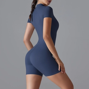 Rear view detail of a navy blue slim fit yoga jumpsuit showing fabric texture and fit