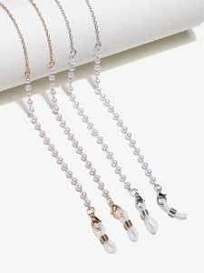 Detail of four gold and silver eyeglass chains with white pearls and silicone loops