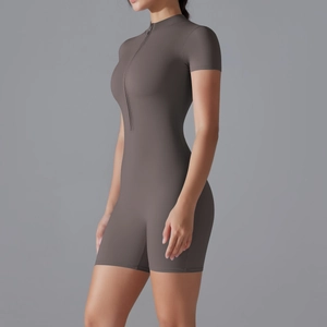 Close-up of deep mocha yoga romper featuring a sleek front zipper and stand-up collar
