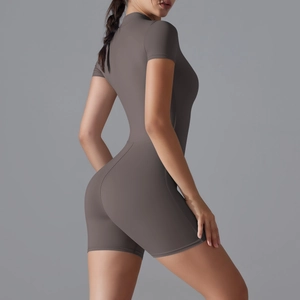 Back view of a short sleeve yoga bodysuit in taupe with slimming fit and high elasticity