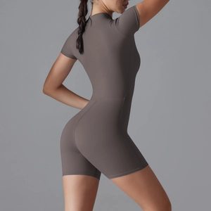 Side view of dark brown tight yoga jumpsuit showing high elastic fabric and fit