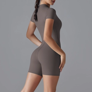 Close-up of the form-fitting yoga romper showing the high-stretch fabric and seamless back