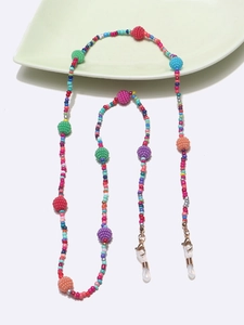 Macro detail of multicolored beads chain with gold lobster clasp and silicone loop holders