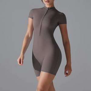 Detail view of coffee yoga romper with front zipper closure and slim fit athletic design