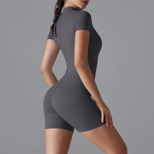Close-up of side view showing the fitted knit texture of dark gray short sleeve yoga romper
