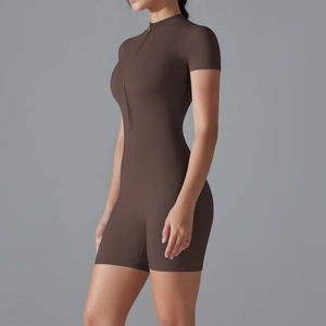 Close-up of a deep brown short-sleeve yoga bodysuit featuring a front half-zipper design