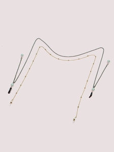 Two-pack of elegant eyeglass chains with metal beads and pearls on a light background