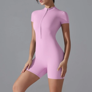 Close-up of pink slim fit yoga bodysuit with front zipper and stand collar detail