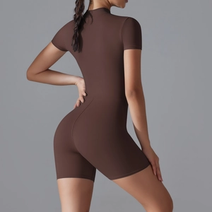 Rear view of tight dark brown yoga bodysuit showing sculpting and lifting effect