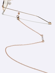 Golden anti-slip eyewear chain with clear crystals and metallic finish for glasses