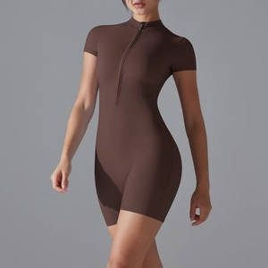 Close-up of the front zipper detail and stand collar on the brown yoga bodysuit