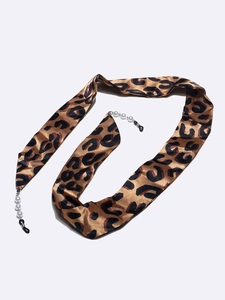 Detail of leopard print ribbon eyewear strap with white pearl beads and rubber loops