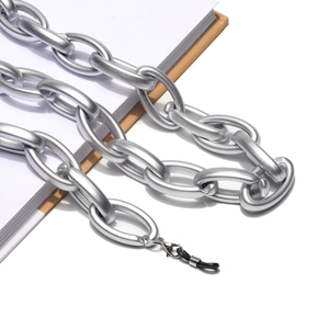 Detail of matte silver chunky acrylic glasses chain with metal lobster clasp and rubber loop