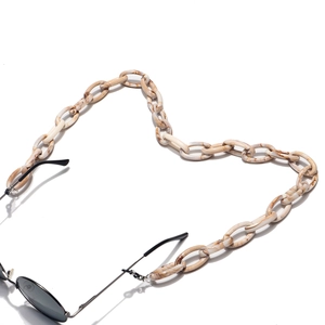 Detail of chunky marble acrylic glasses chain with metal clips and silicone loops