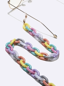 Detail of colorful acrylic eyeglass chain with macaron-tone links and gold lobster clasp