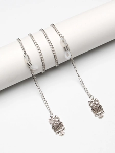 Silver metal eyewear chain featuring owl pendants and white non-slip silicone loops