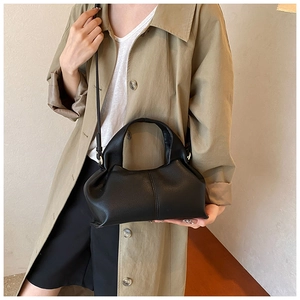 French cloud-shaped handbag in black lychee grain leather with thin shoulder strap