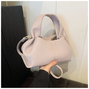 Detail of lavender cloud bag texture with thick handle and matching shoulder strap