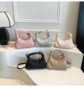 Five pleated crescent bags in pink silver black and cream with knot handle details