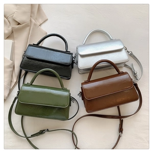 Detailed arrangement of rectangular PU leather bags in black, silver, green, and brown