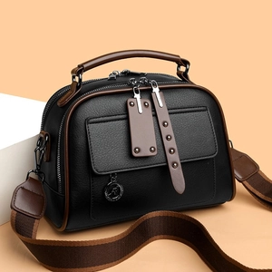 Litchi pattern leather handbag in black and brown with wide striped shoulder strap