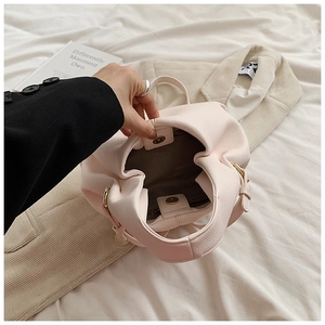 French style beige cloud bag with litchi grain leather and gold hardware detail