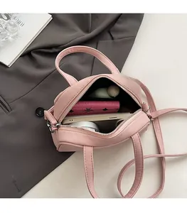 Interior view of the pink pleated shell bag showing spacious storage for daily essentials