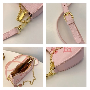 Detailed views of pink leather bag featuring floral clover prints and golden hardware