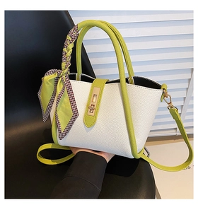 Close-up of lime green and white patchwork handbag with checkered silk scarf detail
