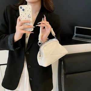 Close-up of white pleated PU leather handbag with silver frame and woven rope handle