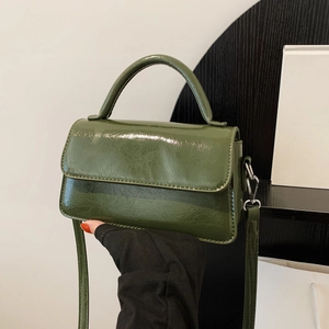 Green patent leather square handbag with top handle and crossbody strap for women