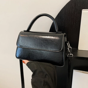 Glossy black vintage textured small square bag with silver hardware and top handle