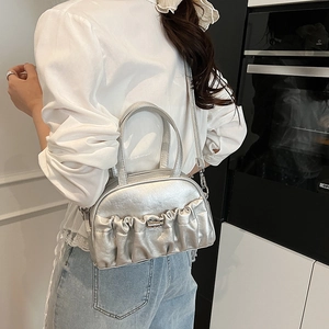 Chic silver pleated crossbody handbag with metallic finish and top handles for women