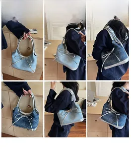 Detailed views of denim underarm bag with bow decoration and metallic silver piping