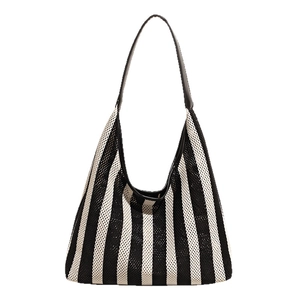 Fashionable woven knit tote bag with black and white vertical stripes and shoulder strap