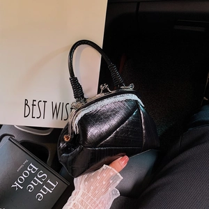 Vintage black doctor bag with metal clasp, white lace trim and woven top handle