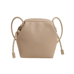 Minimalist beige pebble leather crossbody bag with knot strap and hexagonal structure