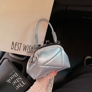 Retro silver metallic kiss-lock handbag with geometric stitching and lace details
