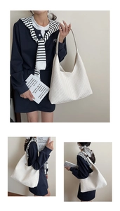 Detailed view of cream woven hobo bag showing intricate V-shape texture and leather strap