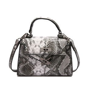 Retro snakeskin pattern trapezoid handbag with metallic lock and adjustable shoulder strap